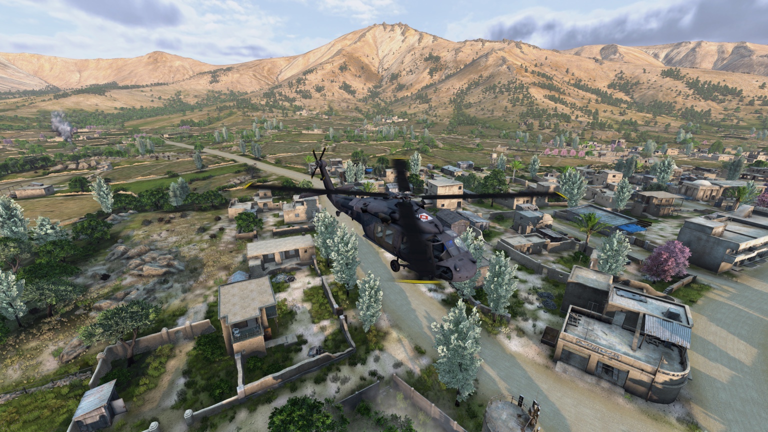 A helicopter flying over a Nasdara town